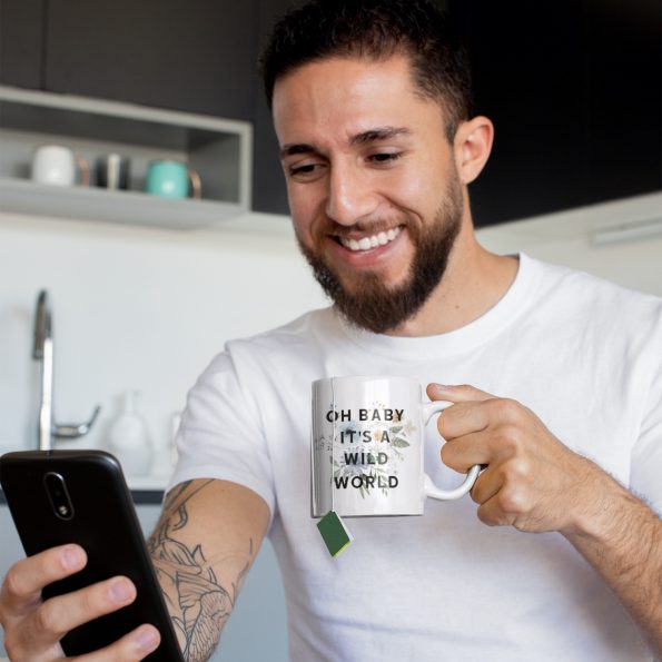 mug-mockup-of-a-tattooed-man-having-some-tea-at-home-24017